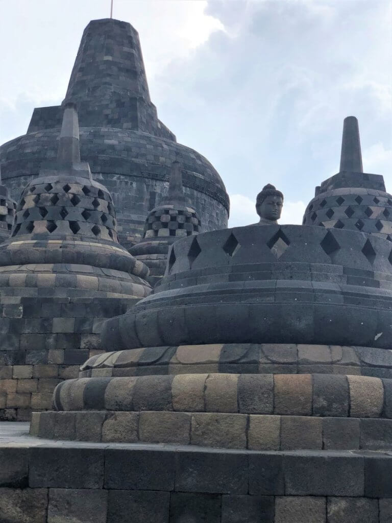 Borobodur temple monk in perforated stupa