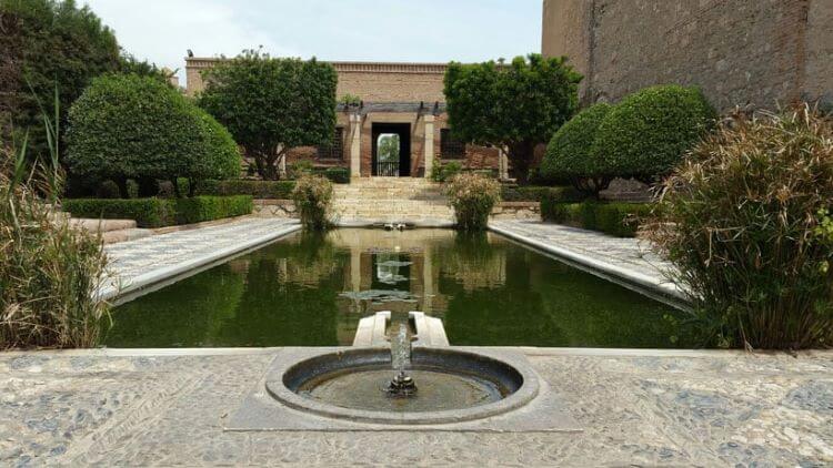A view of the water feature and an entrance to the Alcázaba de Almeria, Almeria, Spain