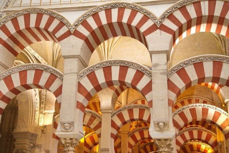 Photo of the iconic striped archways of the Mosque-Cathedral, Córdoba, Spain