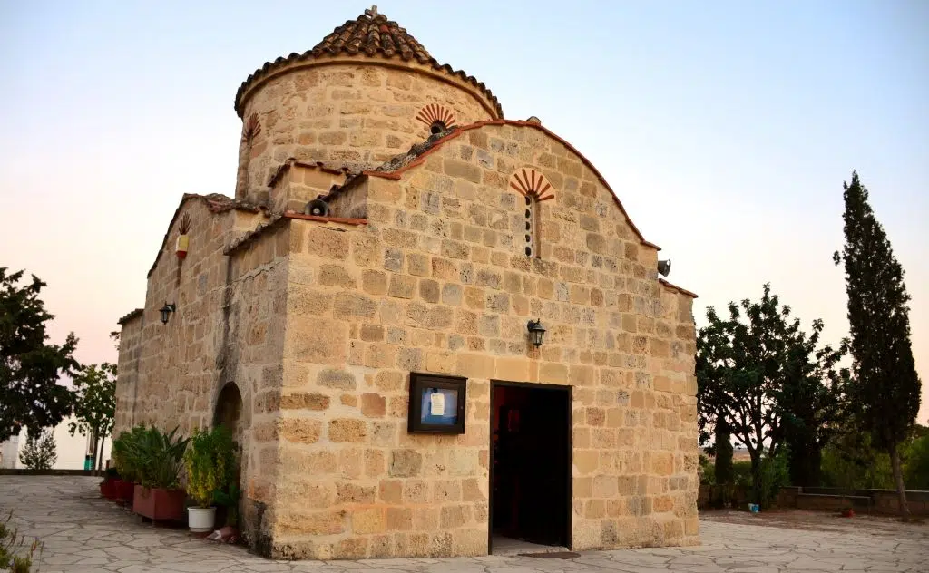 A photo of the small stone Agios Georgios Makrus Church, Griva Digeni Ave, which is a major bus stop in Larnaca, Cyprus