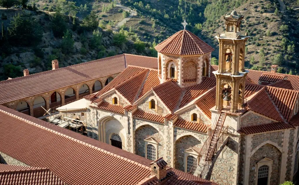 Photo looking down at the red roofs of the Holy, Royal, and Stavropegic Monastery of Machairas, Nicosia, Cyprus