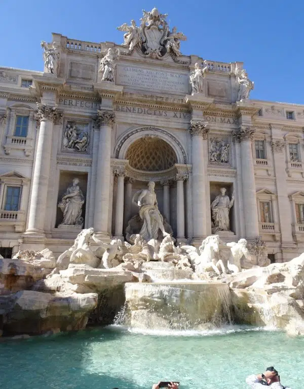 Photo of the Trevi Fountain in Rome on a bright blue day
