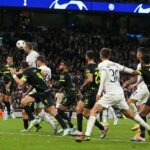 Eric-Dier-of-Tottenham-Hotspur-heads-the-ball-just-wide-during-the-UEFA-Champions-League-match