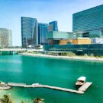 Modern architecture of Al Maryah Island in Abu Dhabi rising across the seaside