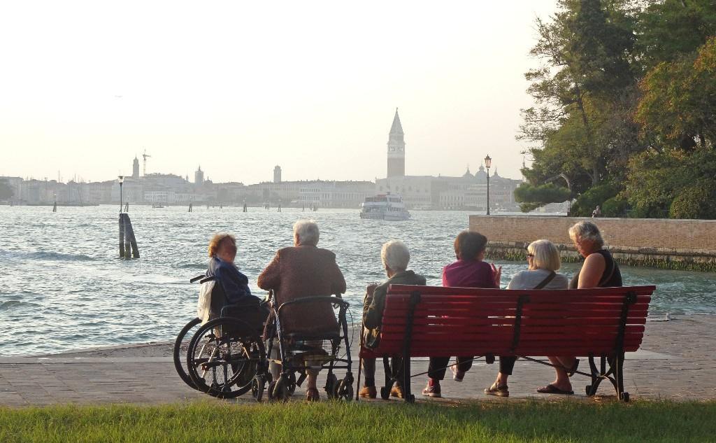 Locals enjoying the afternoon Fall sunshine, Venice, Italy