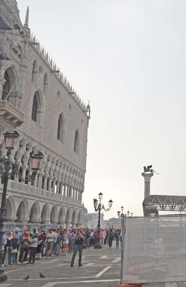 Queue waiting for entry to San Marco Basilica at 10 am on a Morning in late September, winding around the Basilica, along the Doge's Palace, and along the waterfront