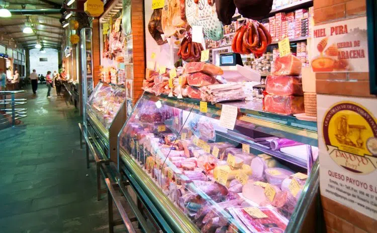 A meat stand at Mercado de Triana's indoor market
