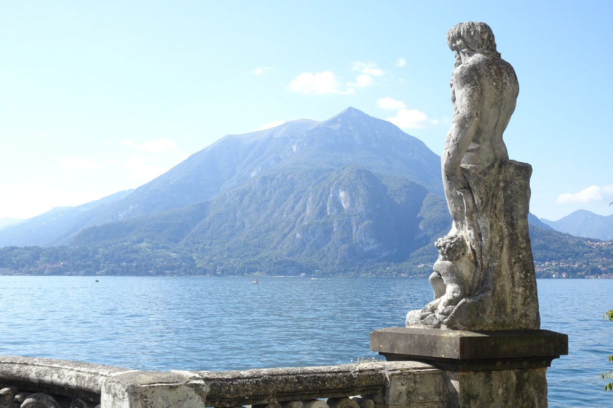 A statue overlooking Lake Como in Italy